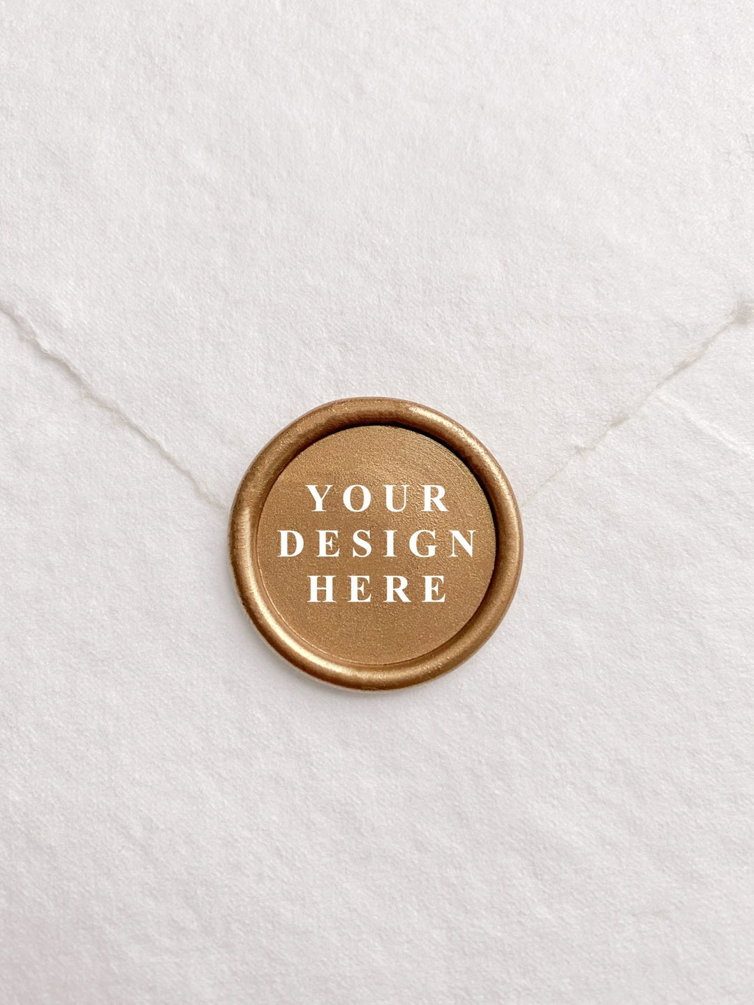 Custom wax seal in gold with your own design on white handmade paper envelope