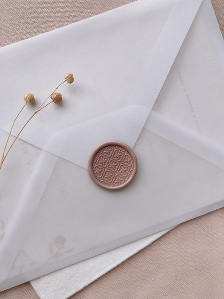 Moroccan tile pattern round wax seal in dusty mauve on vellum  envelope_front angle 