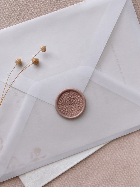 Moroccan tile pattern wax seal in nude brown color on vellum envelope styled with dried flowers