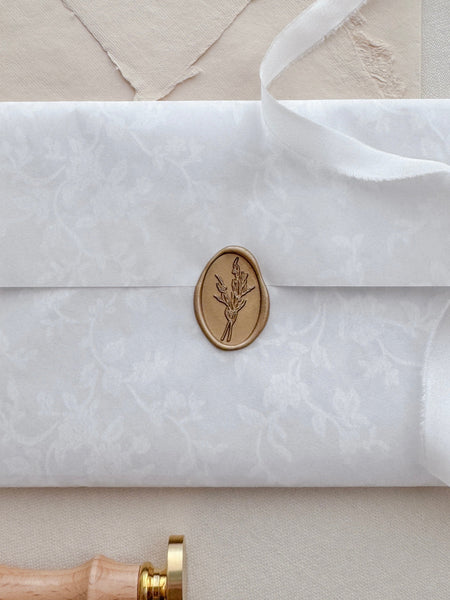 oval flower bouquet gold wax seal on white flower print envelope 