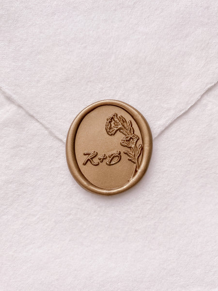 Oval floral monogram gold custom wax seal on beige handmade paper envelope