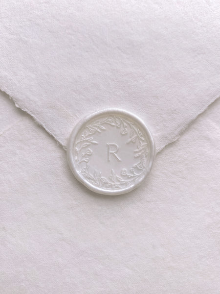 Floral crown single initial wax seal in white pearl color on white handmade paper envelope