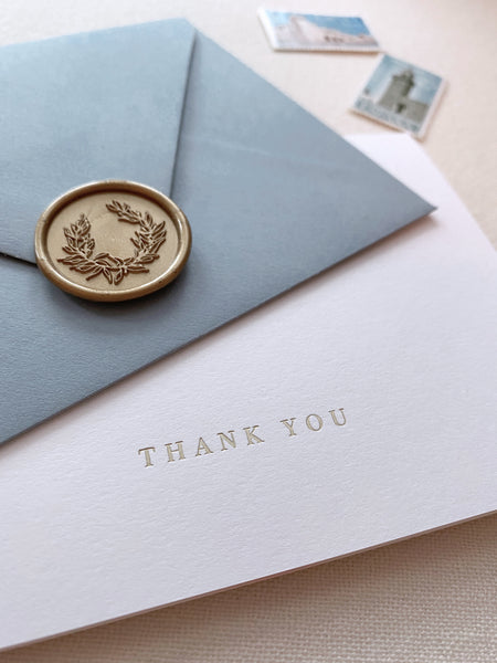 Gold foil press white thank you card with dusty blue envelope and wreath design gold wax seal