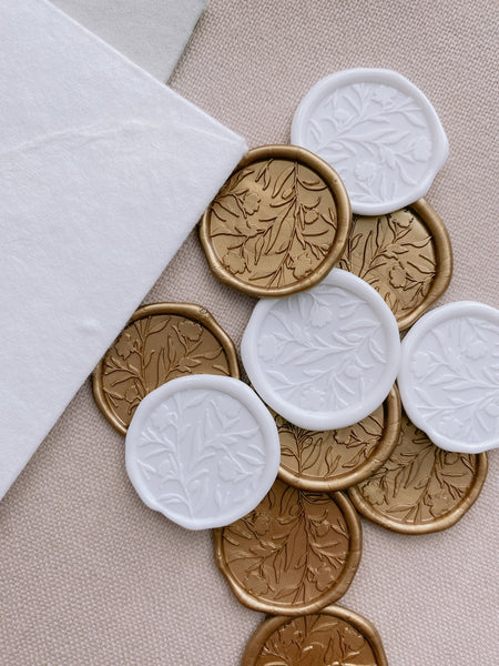 White and gold floral silhouette wax seals