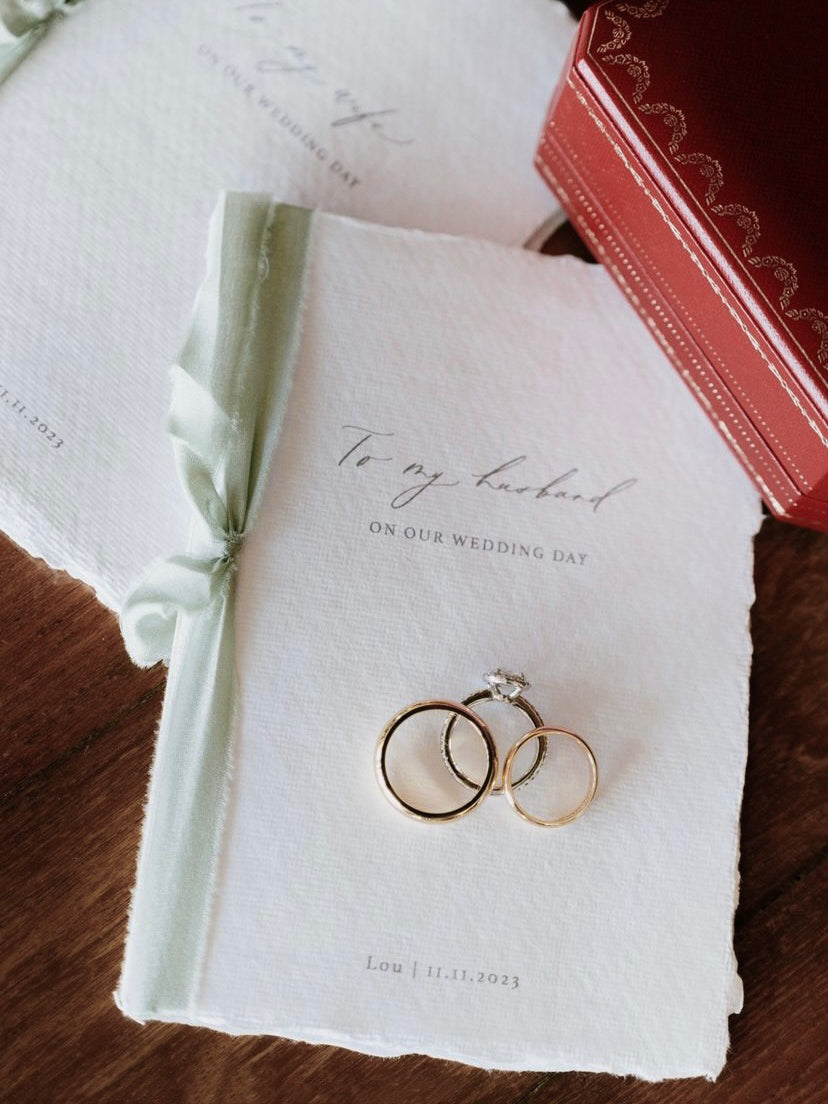 to my wife to my husband wedding vow book with personalized names and date tied in sage green silk ribbon