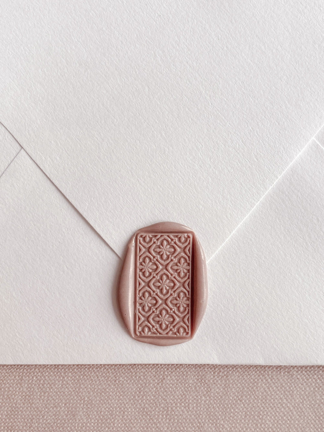 Talavera tile pattern rectangular wax seal in nude brown color on off-white envelope