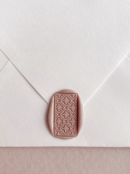 Talavera tile pattern rectangular wax seal in nude brown color on off-white paper envelope