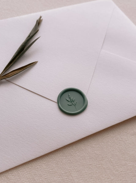 Leaf branch design mini wax seal in sage green on white envelope