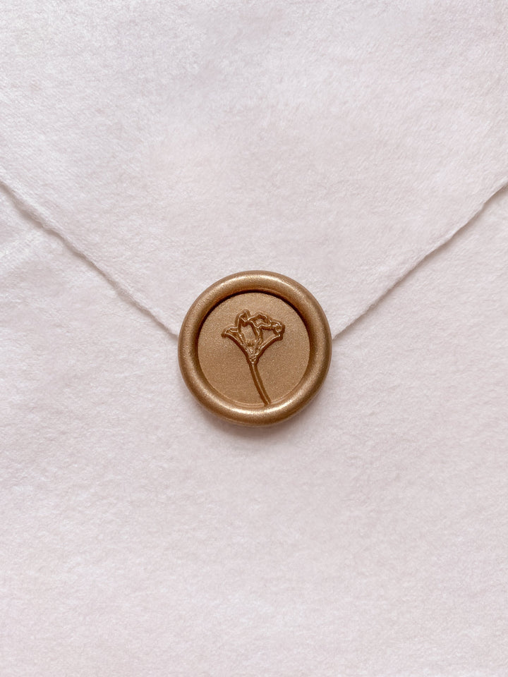 Gold mini flower wax seal on beige handmade paper envelope