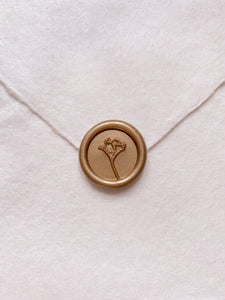 Gold mini flower wax seal on beige handmade paper envelope
