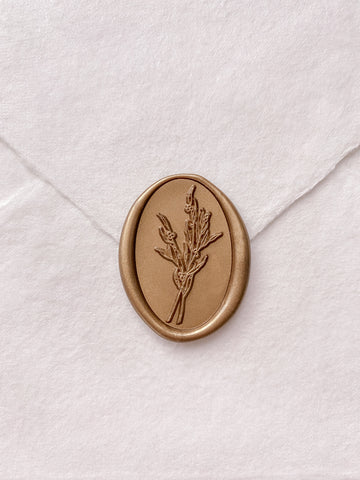 Gold oval flower bouquet wax seal on white handmade paper envelope