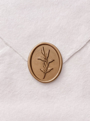 Gold leaf design oval wax seal on beige handmade paper envelope