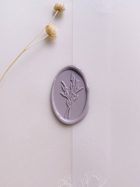 Dusty lavender colored oval floral bouquet wax seal on vellum jacket