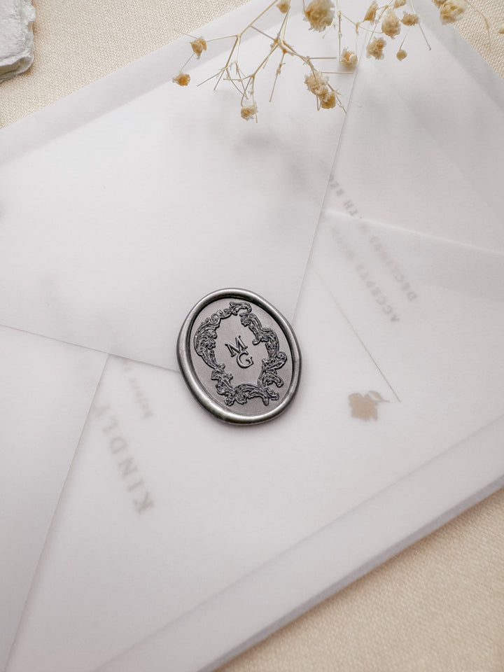 silver vintage crest personalised wax seal on a wedding invitation envelope
