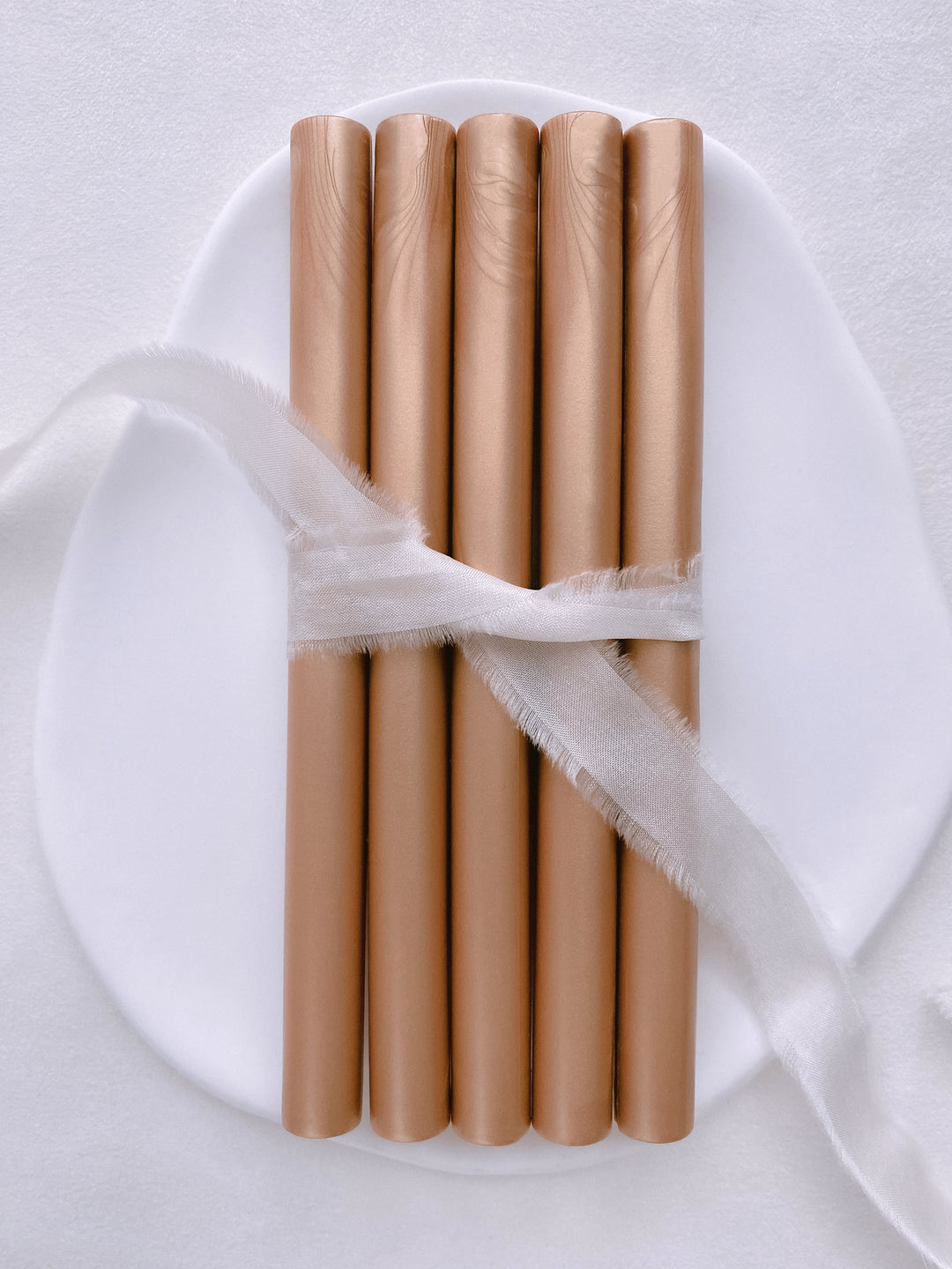 a set of 5 peachy gold glue gun sealing wax sticks