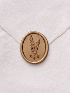 Rosemary leaf monogram gold custom wax seal on beige handmade paper envelope