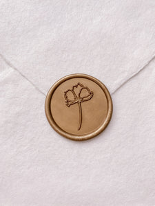 Gold simple flower round wax seal on beige handmade paper envelope