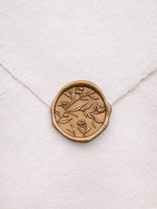 Floral pattern gold wax seal with 3D engraving on a white handmade paper envelope