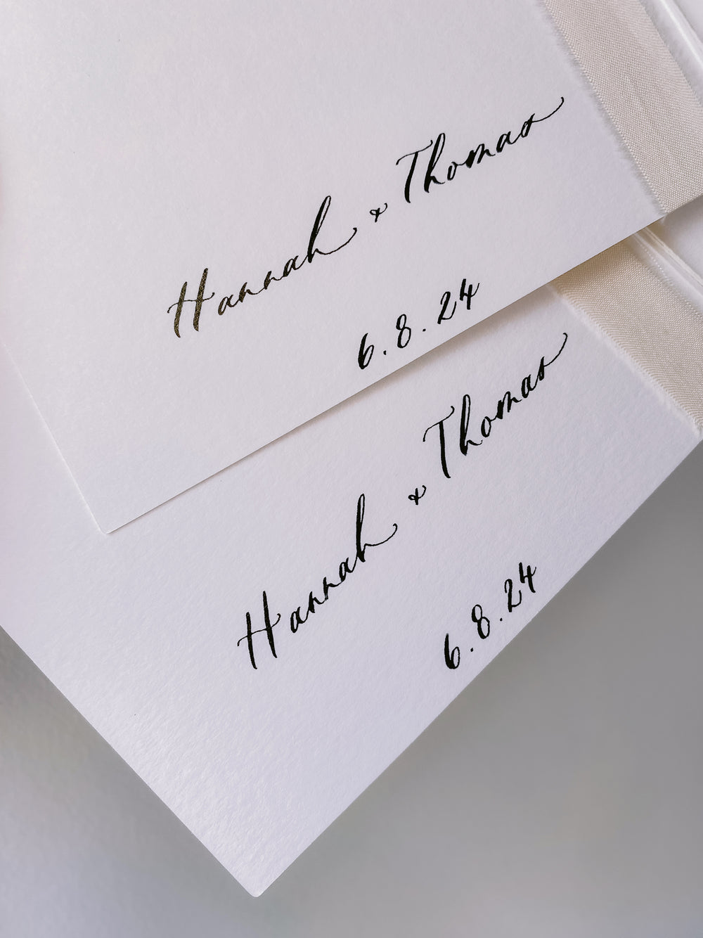 White vow books showing inner cover personalized with the couple's names and wedding date