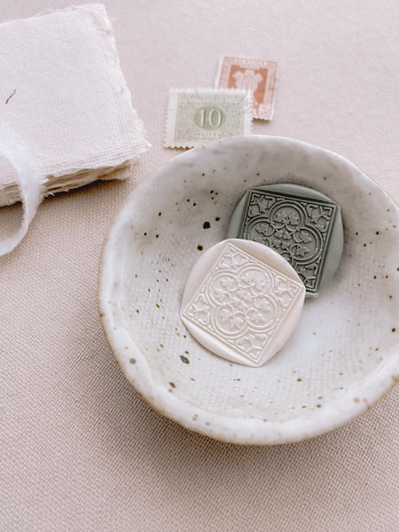 Moroccan tile pattern square shaped wax seals in white and sage green