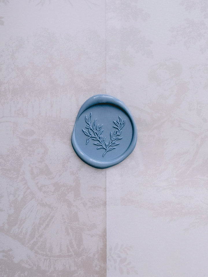 Botanical print dusty blue wax seal on a printed vellum jacket