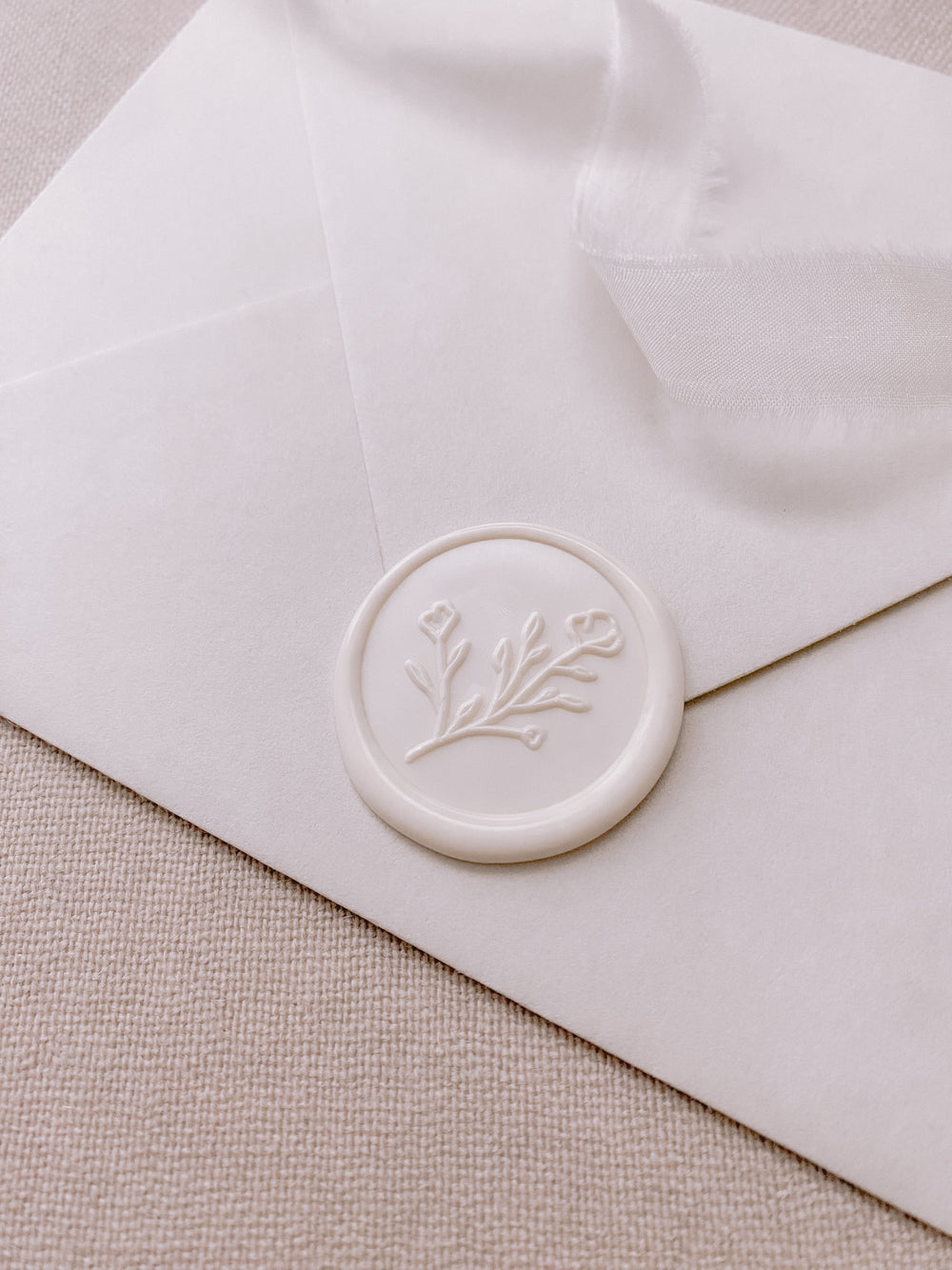 Botanical floral round wax seal in off white on paper envelope