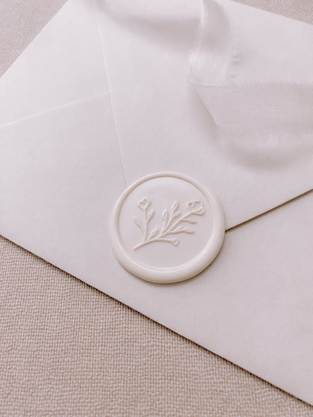 Botanical floral round wax seal in off white on paper envelope
