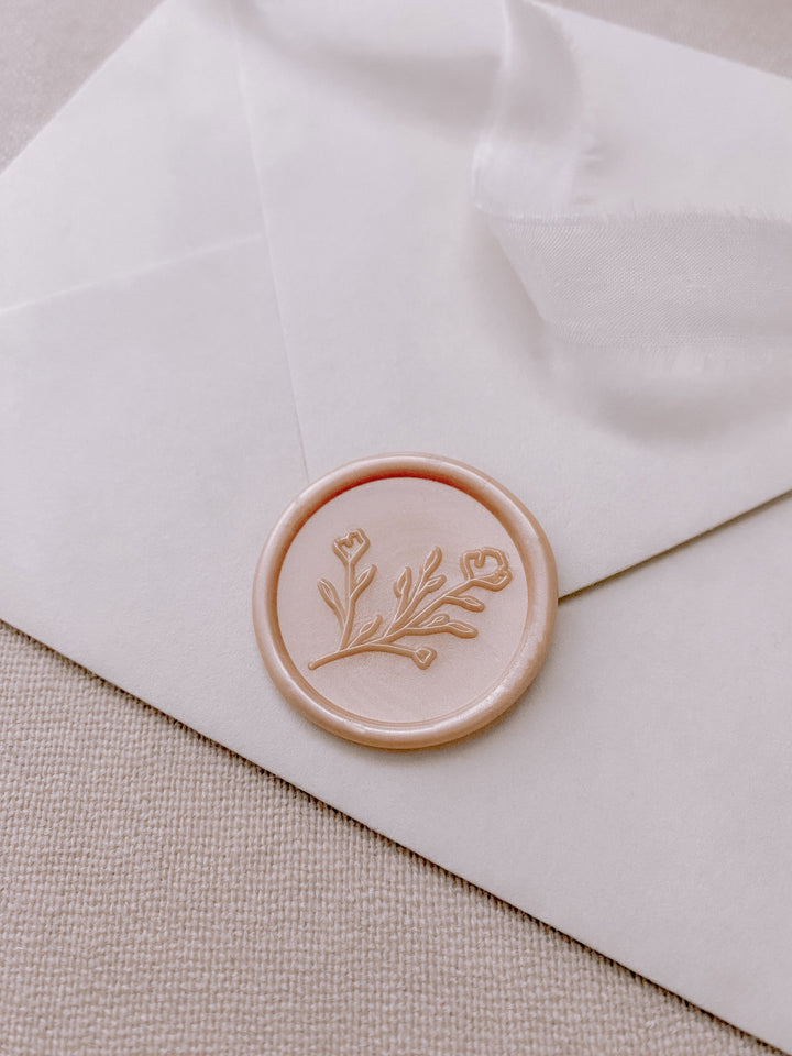Botanical floral round wax seal in nude pearl on paper envelope_side angle