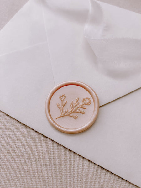 Botanical floral round wax seal in nude pearl on paper envelope_side angle