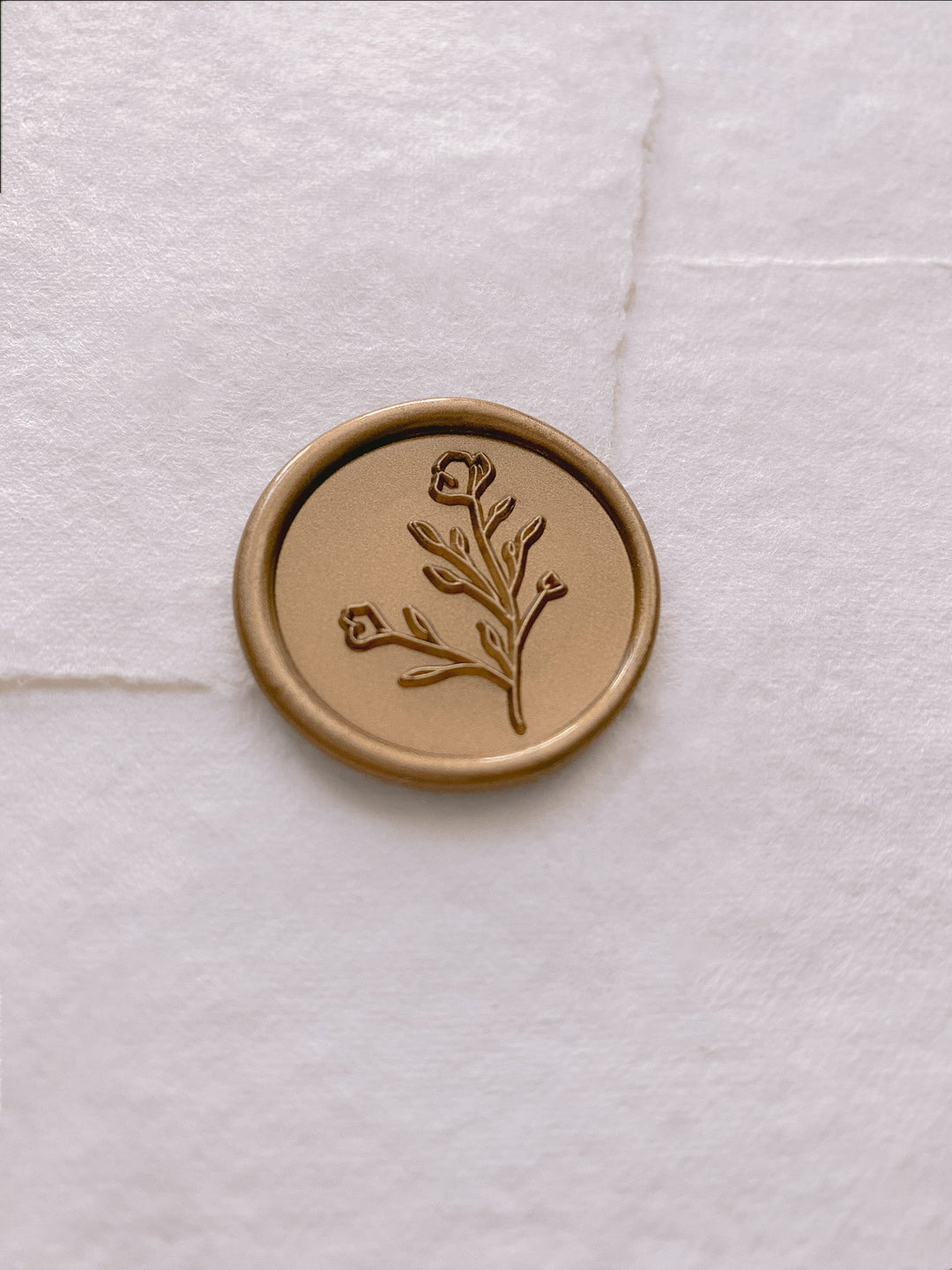 Botanical floral round wax seal in gold on handmade paper envelope_side angle