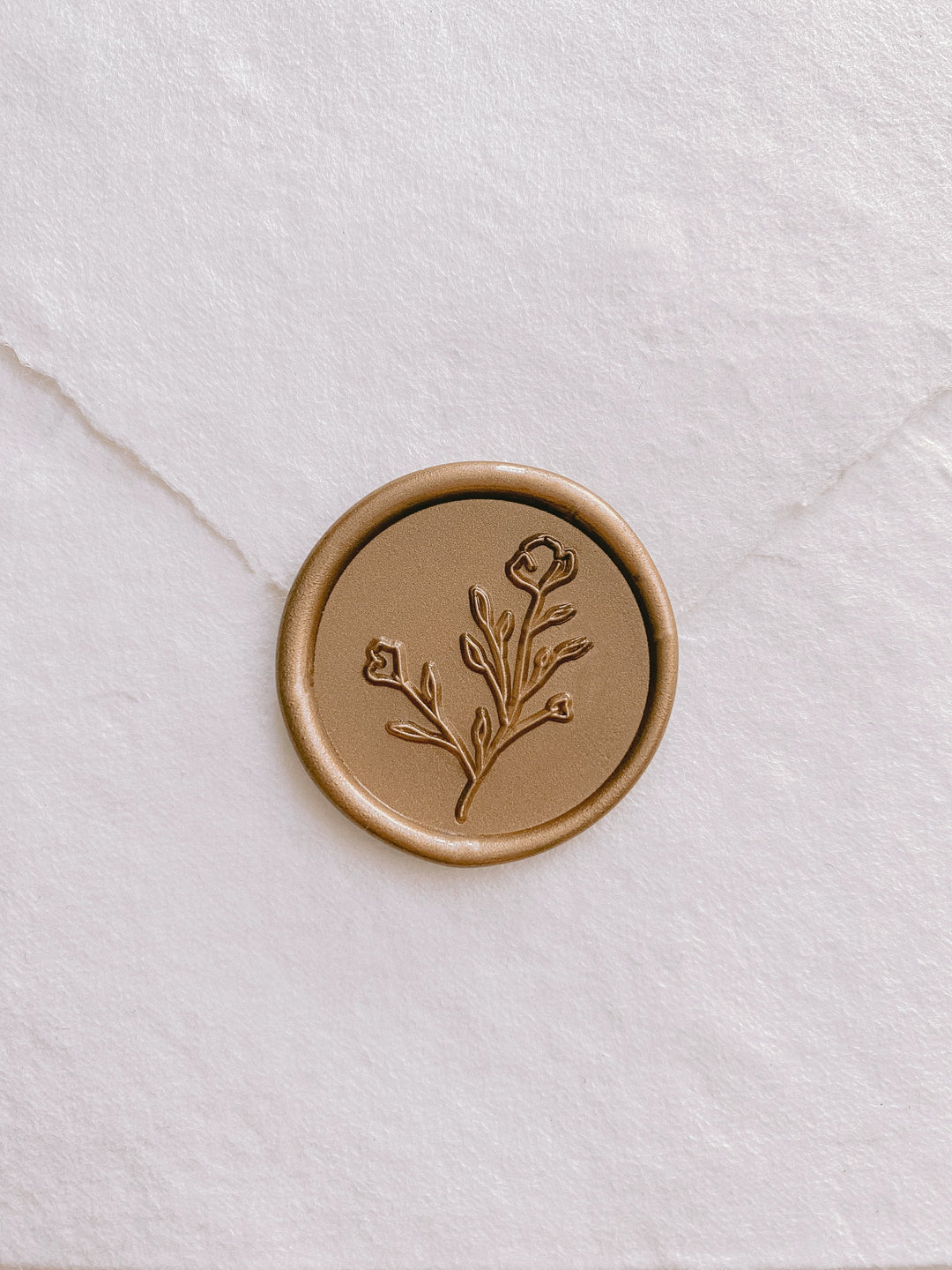Botanical floral round wax seal in gold on handmade paper envelope_front angle