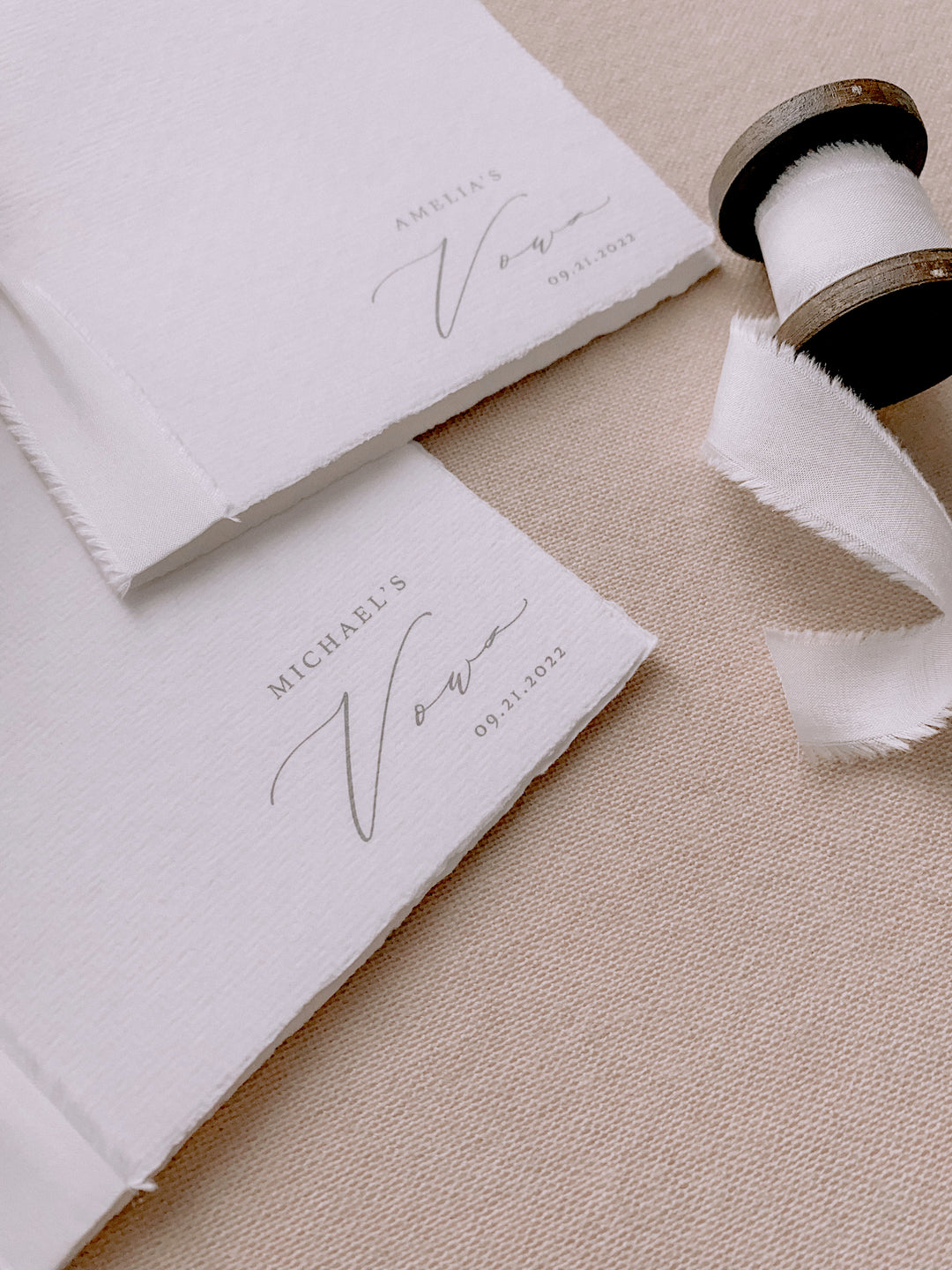 white handmade paper vow books personalized with the couple&