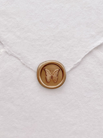 butterfly mini gold wax seal on white handmade paper envelope 