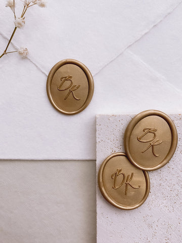 Calligraphy monogram oval wax seals in light gold