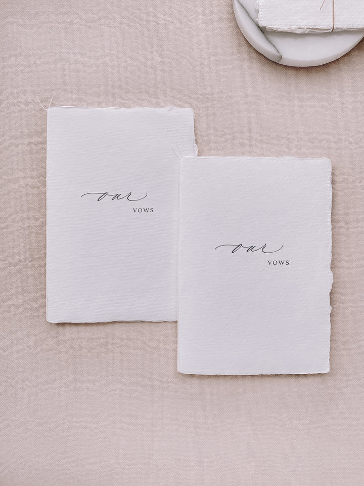 our vows white handmade paper vow books tied in white twine