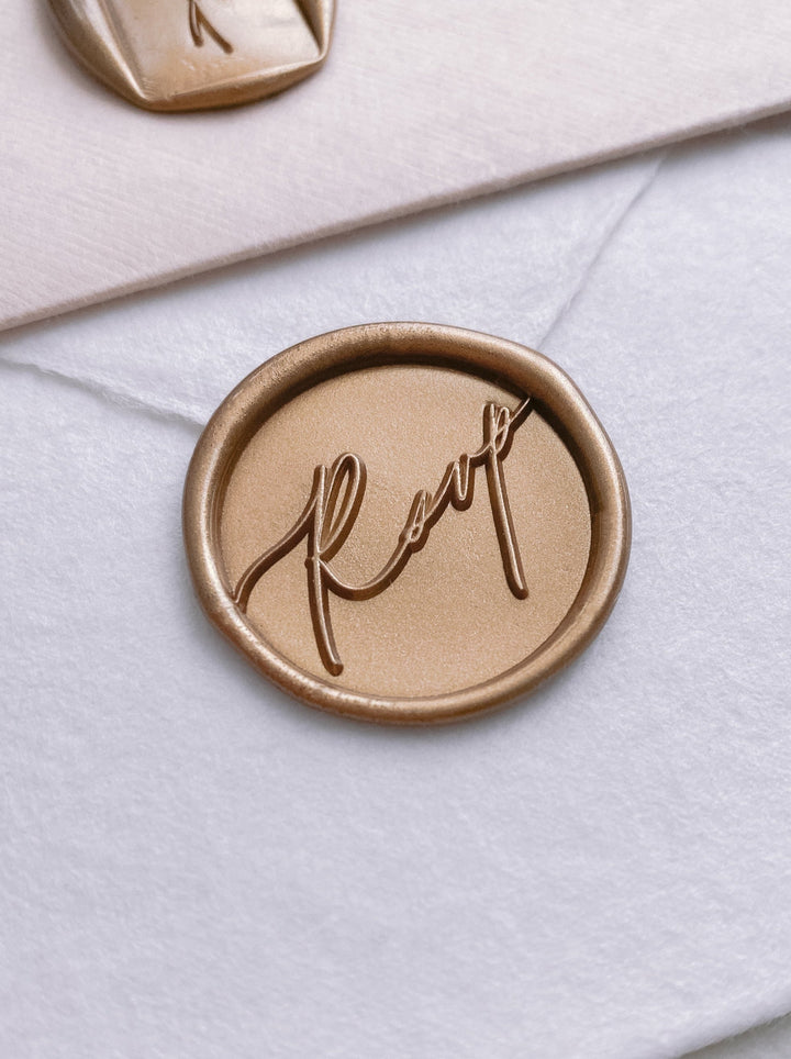 Gold calligraphy script rsvp wax seal on white handmade paper envelope