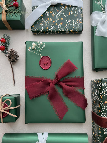 red reindeer seal decorated on Christmas gifts