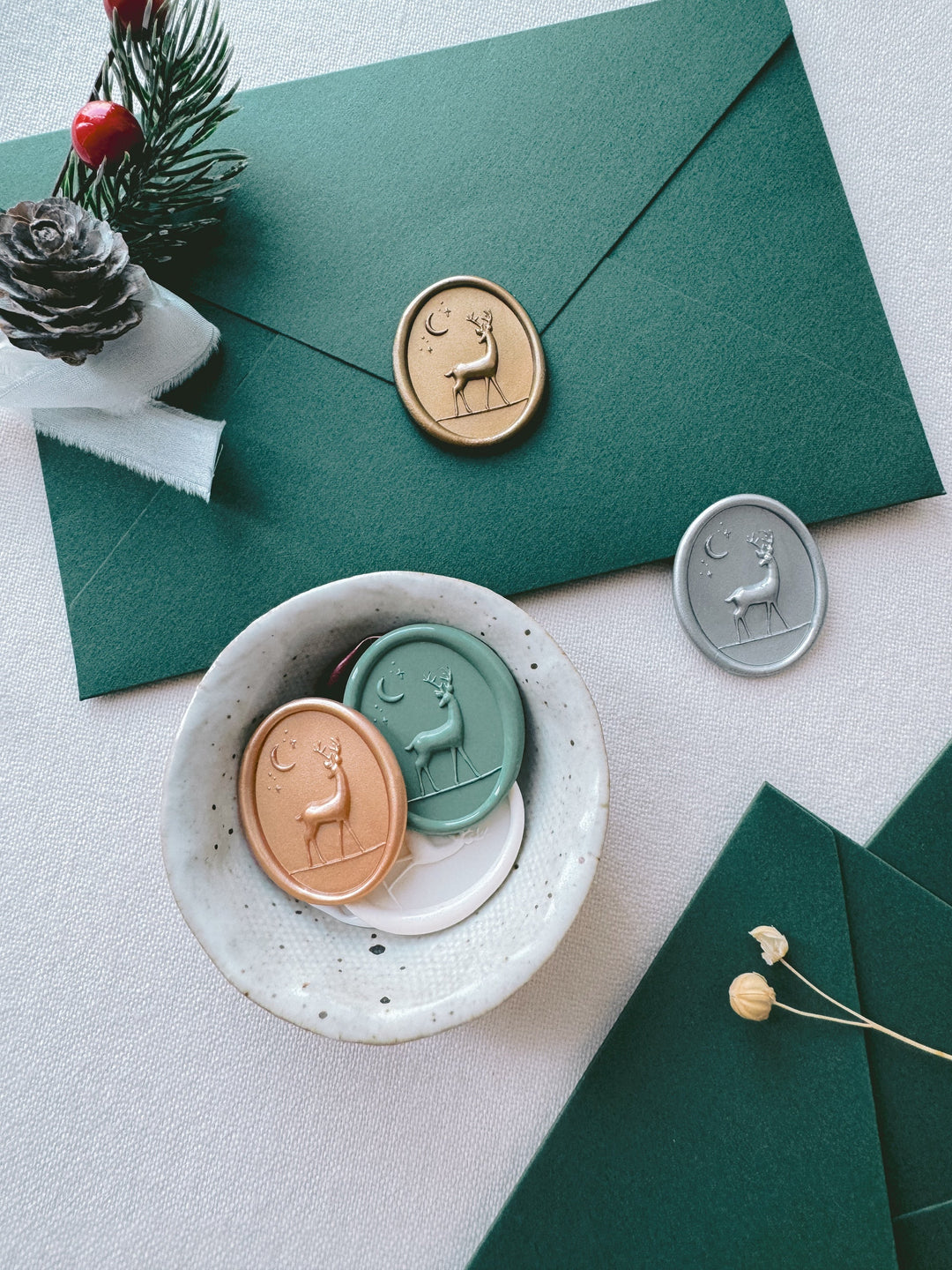 3D Christmas reindeer wax seals on holiday card envelopes