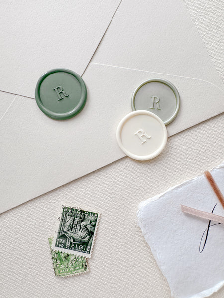 Personalized single initial wax seals in off-white, sage green and light metallic green