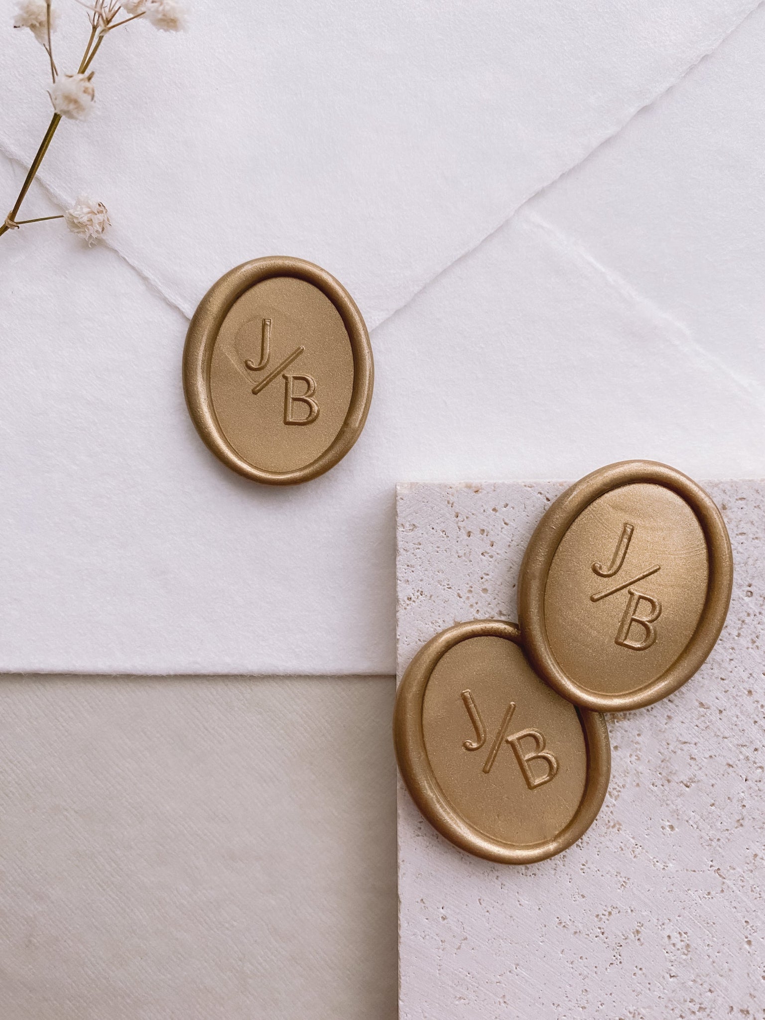 Classic oval monogram wax seals in light gold