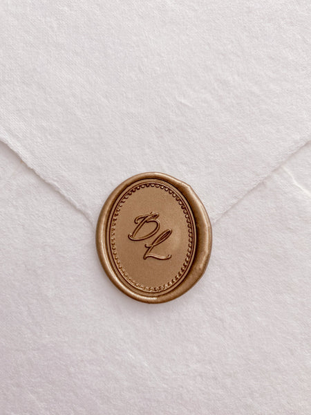 Classique Border Monogram Oval Wax Seal in gold on handmade paper envelope