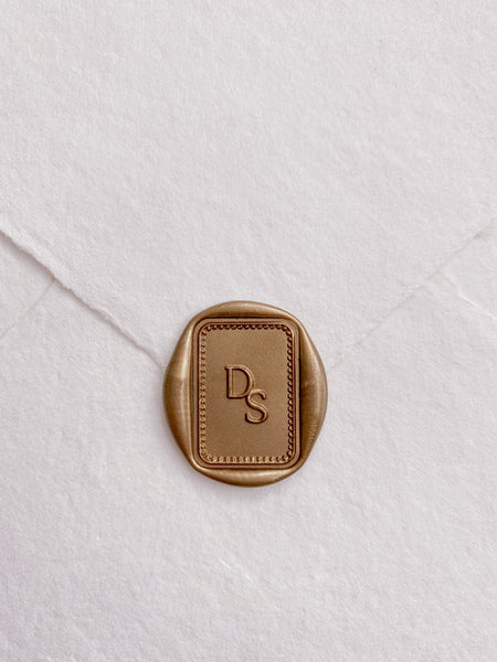 Classique Border Monogram Rectangular Wax Seal in light old on handmade paper envelope
