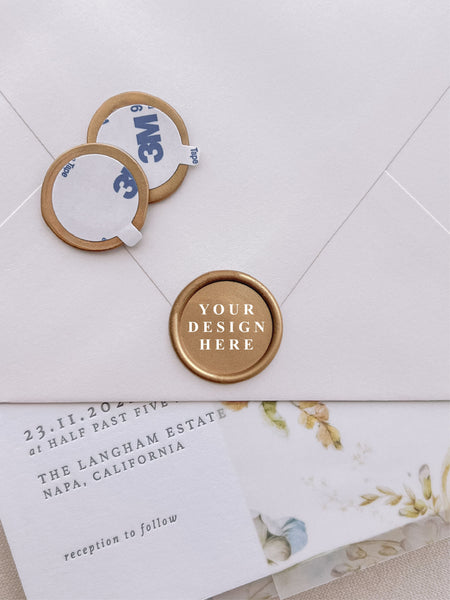 Custom pre-made gold wax seal stickers with text YOUR DESIGN HERE on a wedding invitation card and envelope 