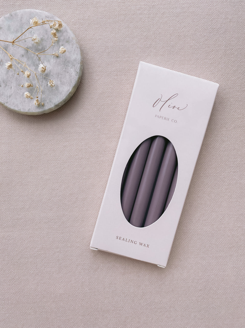 a box of 5 dark purple sealing wax sticks_side angle
