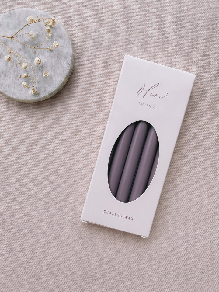 a box of 5 dark purple sealing wax sticks_side angle