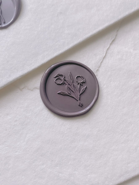 Mauve flower bouquet wax seal on white handmade paper envelope