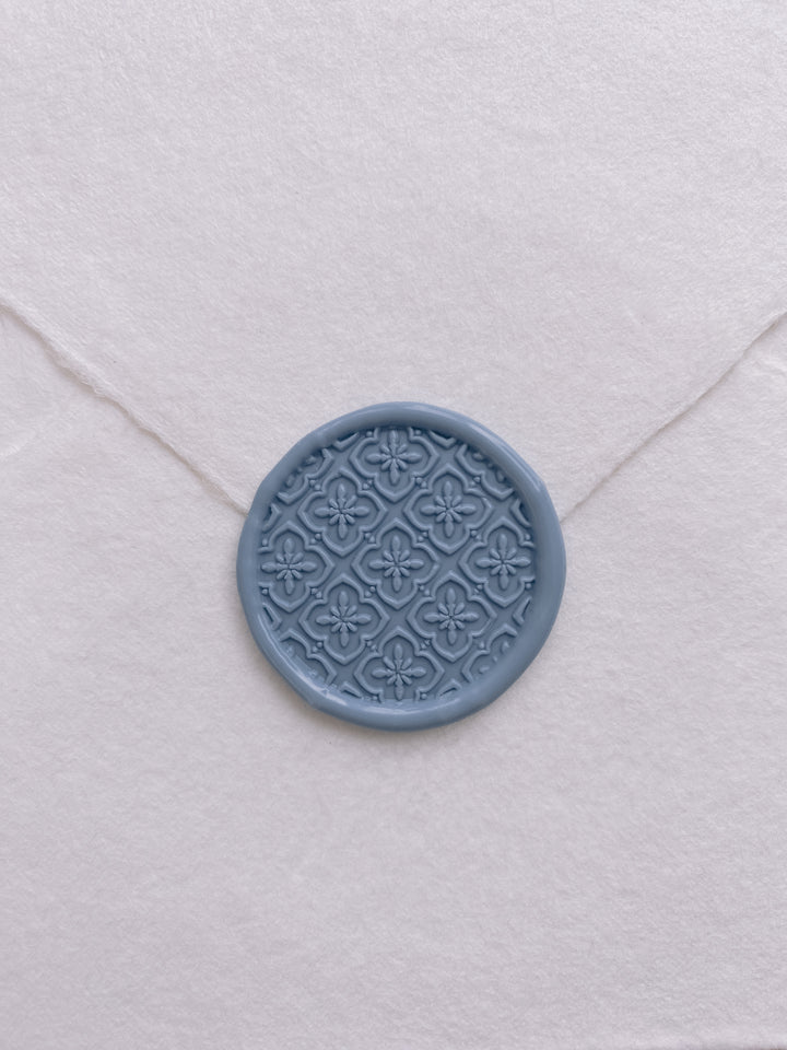 Moroccan tile pattern wax seal in dusty blue on beige handmade paper envelope