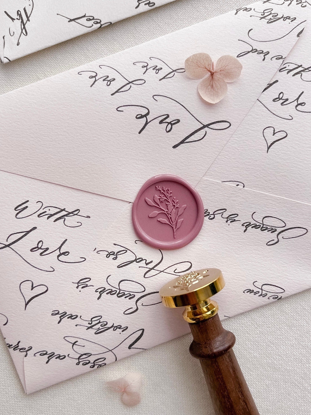 eucalyptus bouquet botanical wax seal is dusty rose color on a pink envelope 
