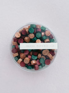 Christmas assorted festive colors sealing wax beads in a mix of gold, red and green