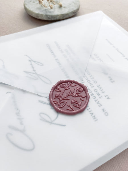 Floral wax seal with 3D engraving in dusty rose on a wedding invitation vellum envelope